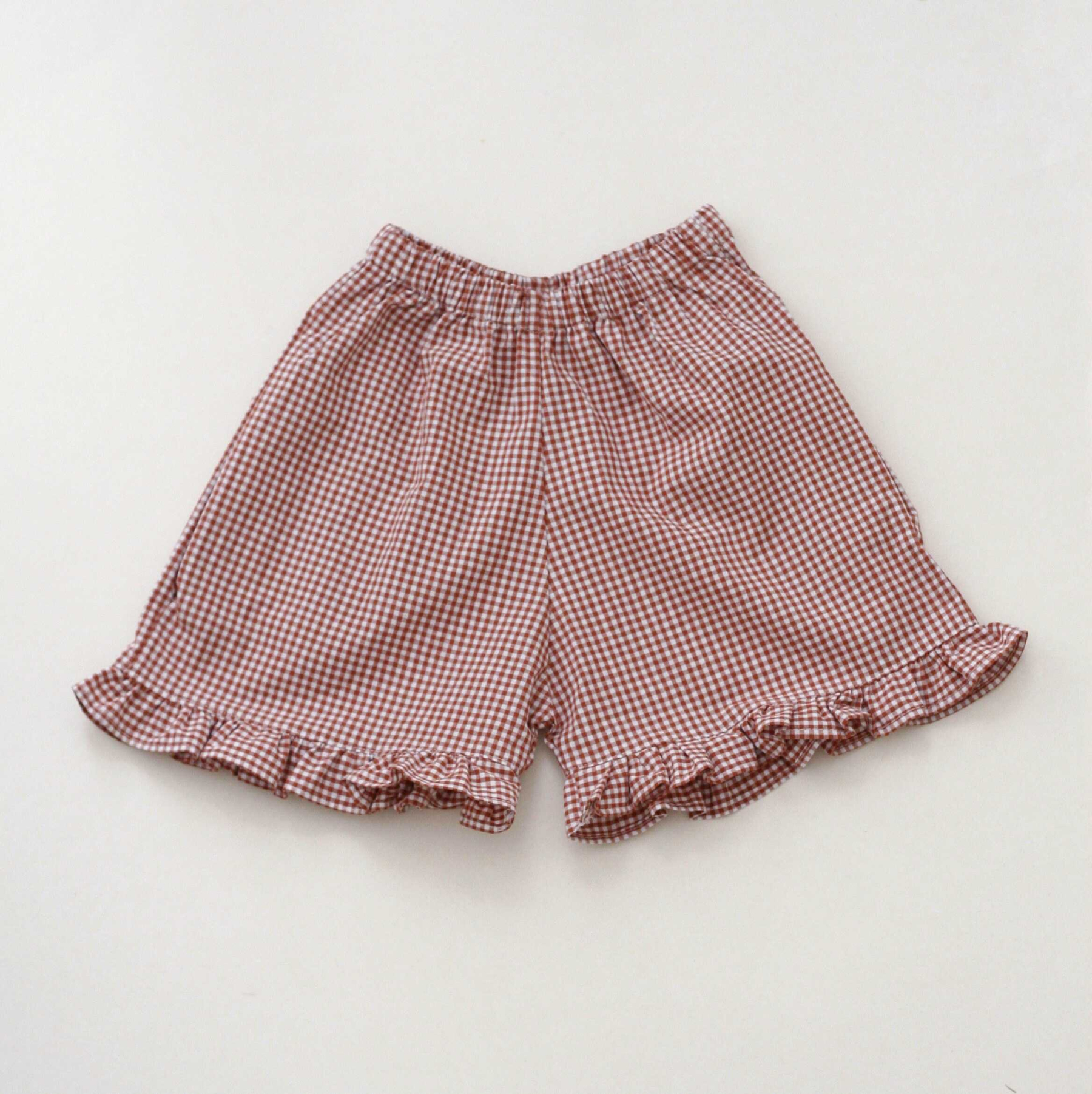 Kostkované kraťasy s kanýrem